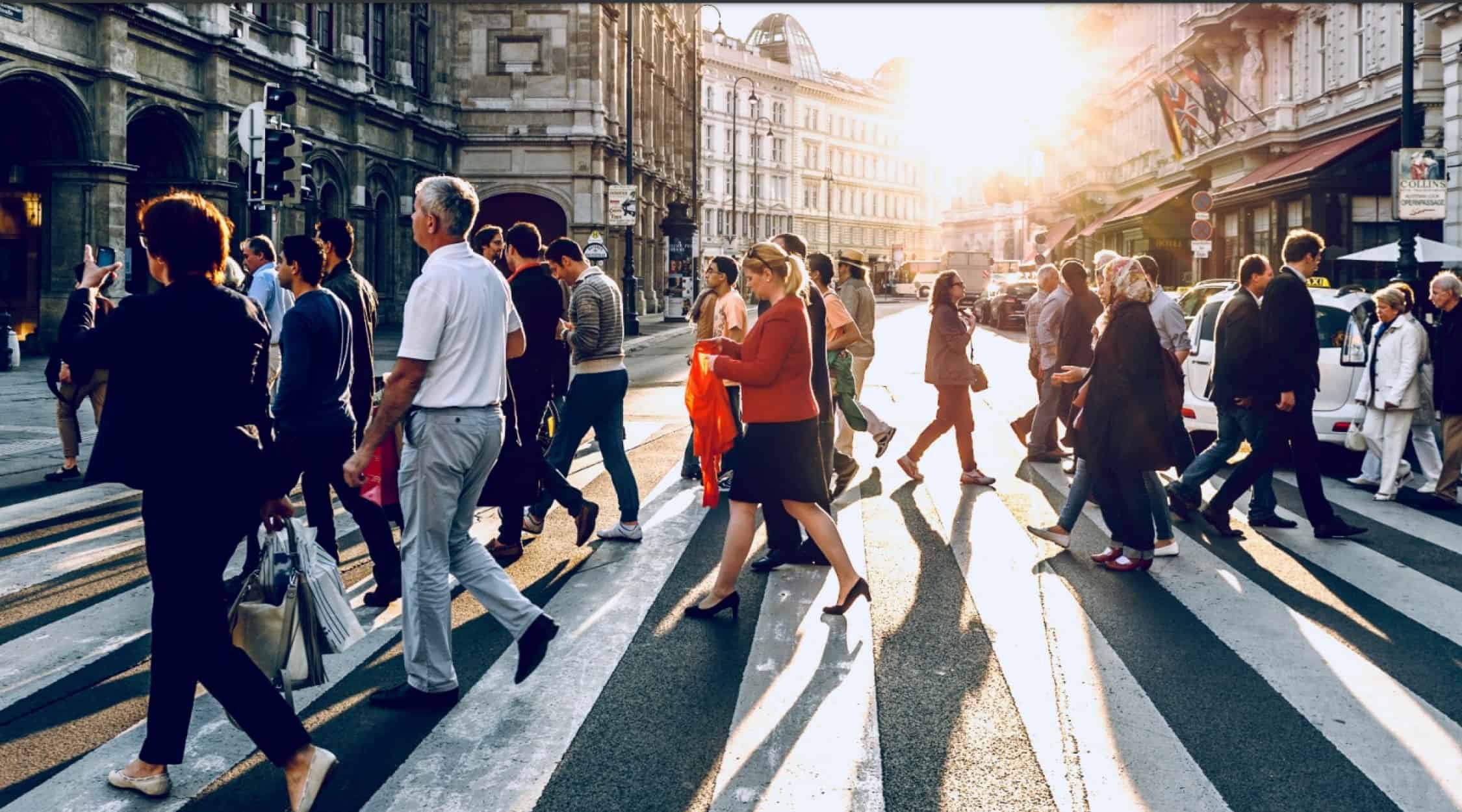 Stock image of people crossing a street